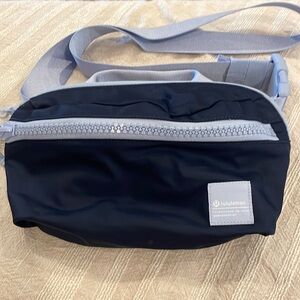 Lululemon belt bag. Navy blue with light blue strap and zippers